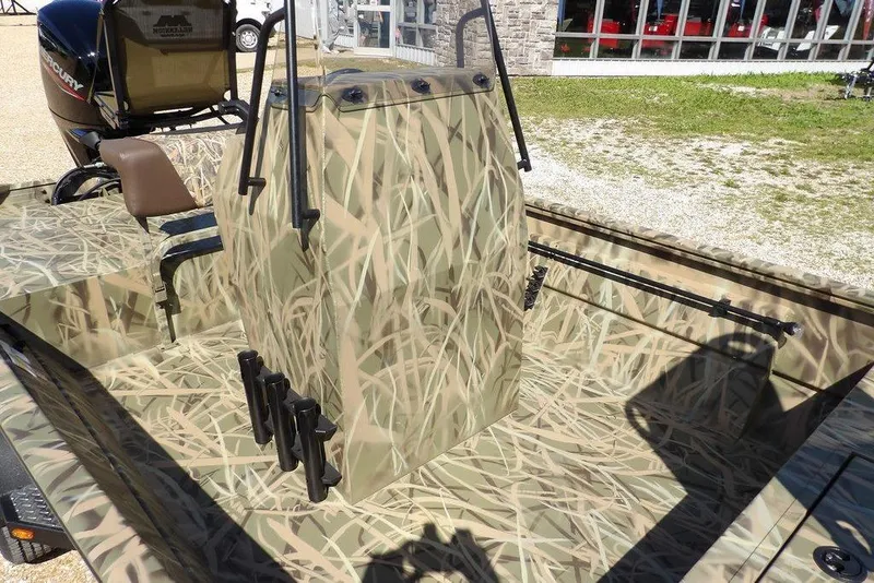 Slide: The Image of 2026 Crestliner 1860 Retriever CC boat with camouflage design and central console. - 12