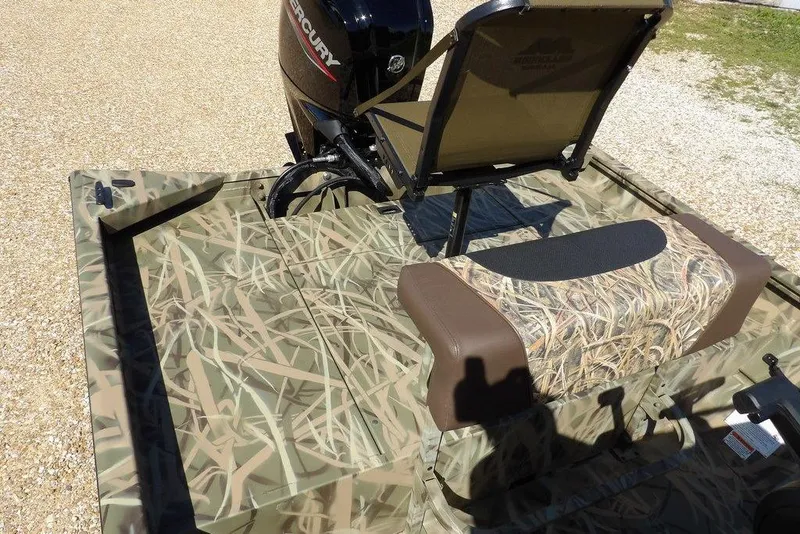 Slide: The Image of 2026 Crestliner 1860 Retriever CC boat with camouflage seating and Mercury engine. - 14