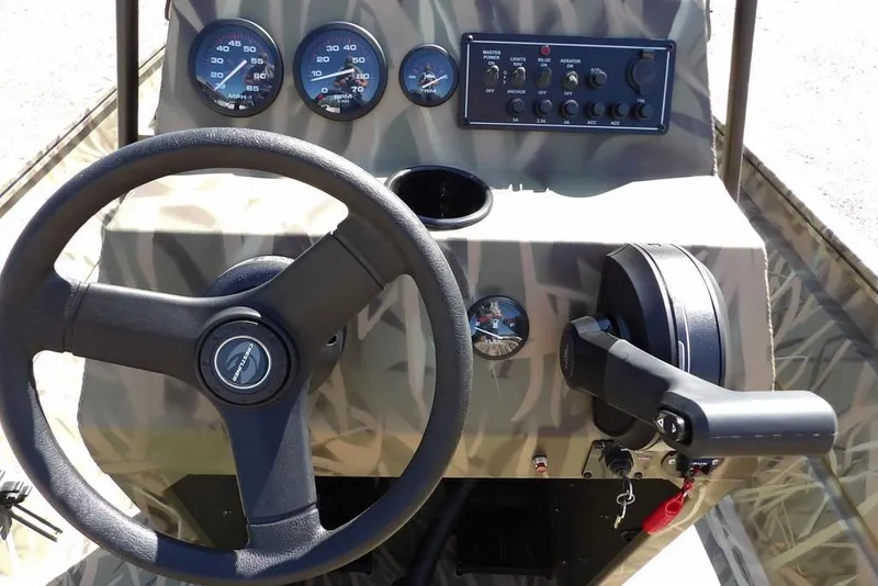 Slide: The Image of Steering console of 2026 Crestliner 1860 Retriever CC boat with gauges and controls. - 18