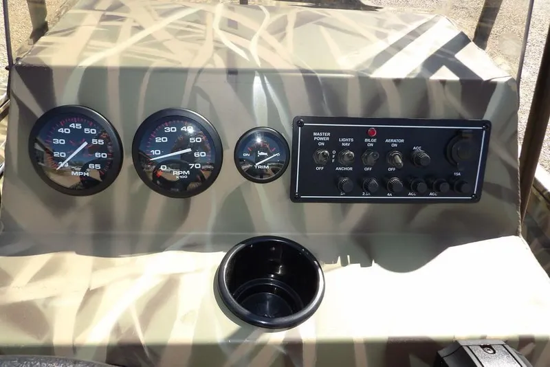 Slide: The Image of Control panel of 2026 Crestliner 1860 Retriever CC boat with gauges and switches. - 19