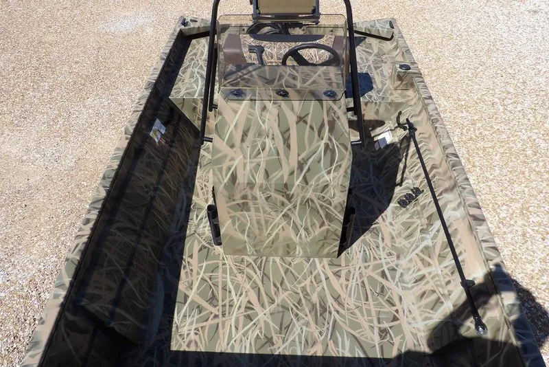 Slide: The Image of 2026 Crestliner 1860 Retriever CC boat with camouflage design and central console. - 25