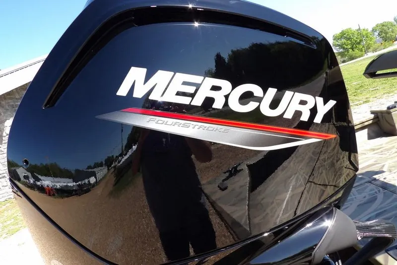 Slide: The Image of Mercury FourStroke engine on 2026 Crestliner 1860 Retriever CC boat, reflecting outdoor scenery. - 26