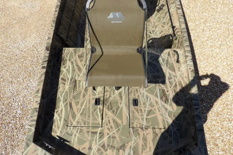 Slide: The Image of 2026 Crestliner 1860 Retriever CC boat with camouflage design and central seating. - 28
