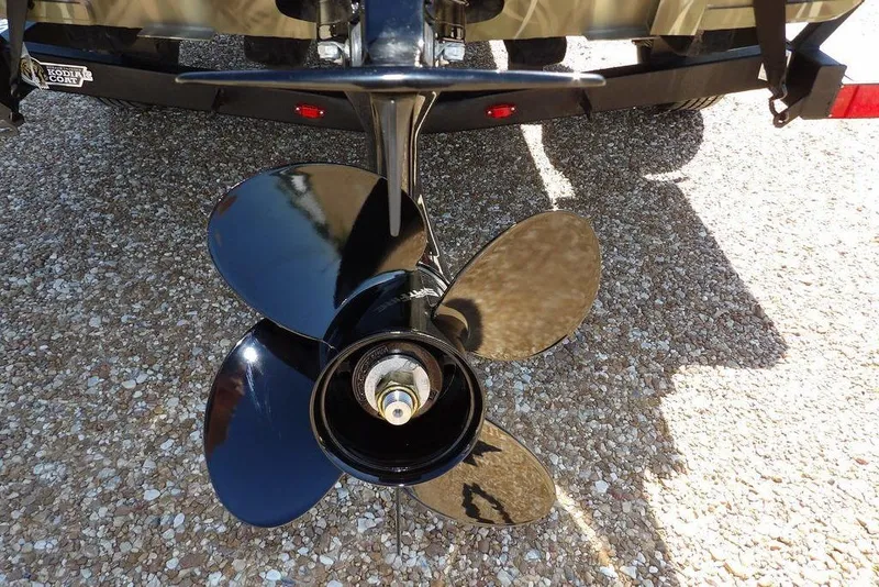 Slide: The Image of Propeller of 2026 Crestliner 1860 Retriever CC boat on gravel surface. - 34