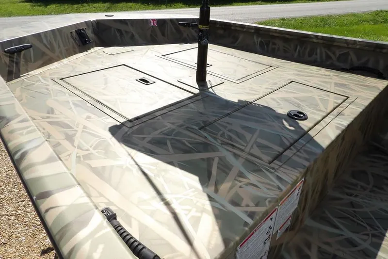 Slide: The Image of 2026 Crestliner 1860 Retriever CC boat with camouflage deck design. - 5