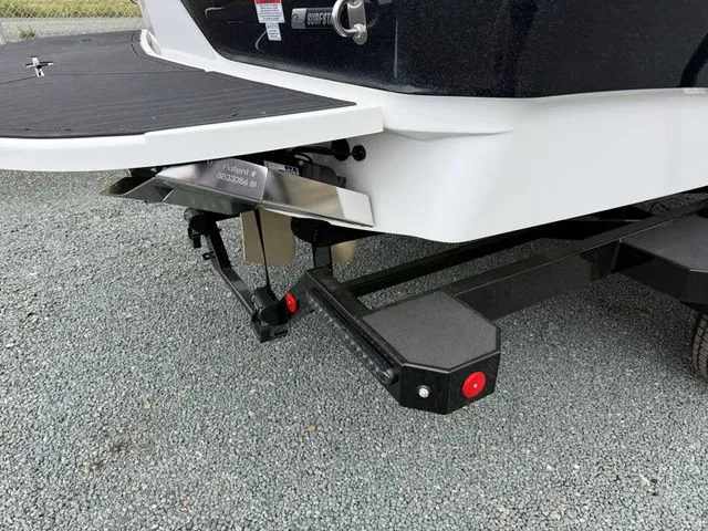 Slide: The Image of Rear view of a 2026 MasterCraft XT22 boat on trailer. - 11