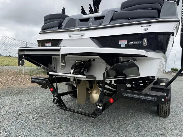 Slide: The Image of Rear view of a 2026 MasterCraft XT22 boat on a trailer. - 12