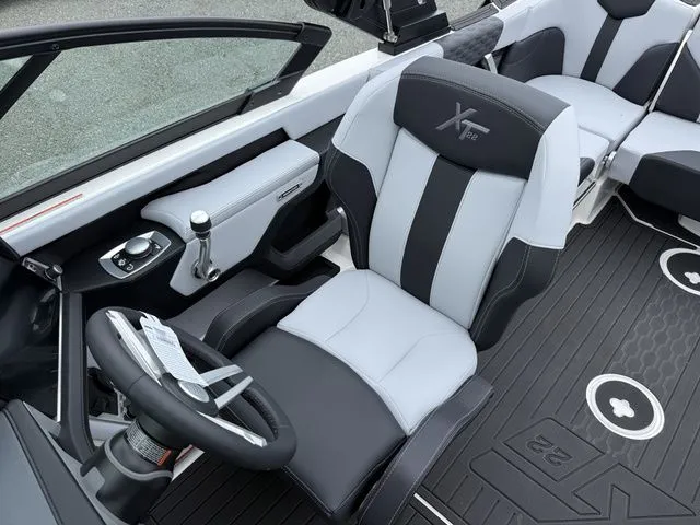Slide: The Image of Interior of 2026 MasterCraft XT22 with stylish seating design. - 16