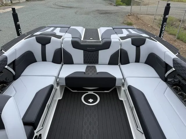 Slide: The Image of Interior of a 2026 MasterCraft XT22 boat with modern seating. - 19