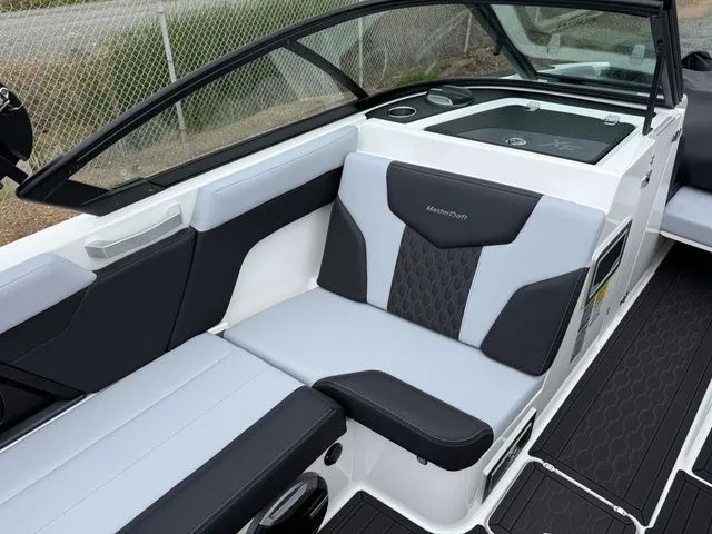 Slide: The Image of Interior of 2026 MasterCraft XT22 boat with stylish seating. - 23