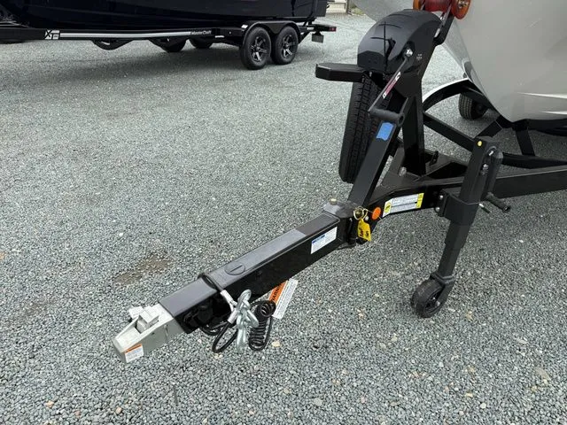 Slide: The Image of Trailer of a 2026 MasterCraft XT22 boat on gravel surface. - 8