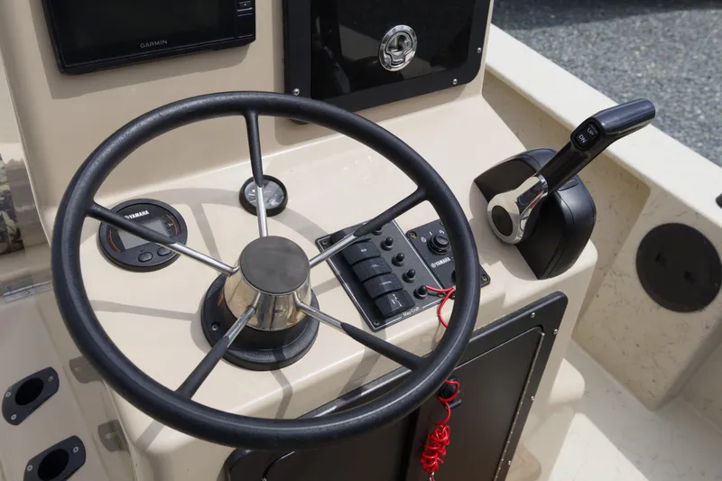 Slide: The Image of Steering console of a 2018 May-Craft 1800 Skiff with Yamaha controls and Garmin display. - 10
