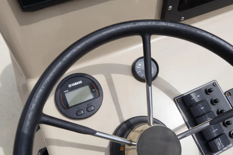 Slide: The Image of Steering wheel and dashboard of 2018 May-Craft 1800 Skiff with Yamaha tachometer. - 11
