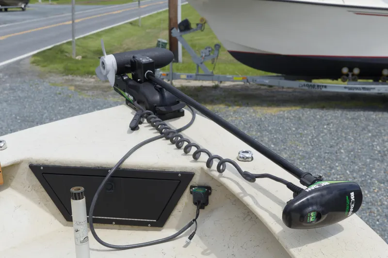 Slide: The Image of 2018 May-Craft 1800 Skiff with trolling motor on deck, parked near road. - 5