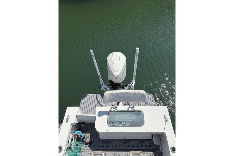 Slide: The Image of 2021 Pair Customs 24 Center Console MV boat on water, rear view. - 10