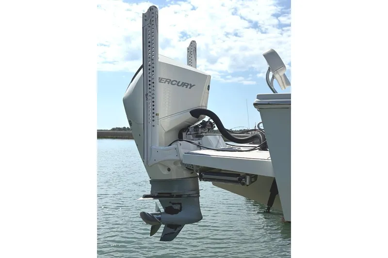 Slide: The Image of Outboard motor on 2021 Pair Customs 24 Center Console MV boat in water. - 4