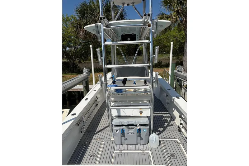 Slide: The Image of 2021 Pair Customs 24 Center Console MV boat with sleek deck and fishing equipment. - 6