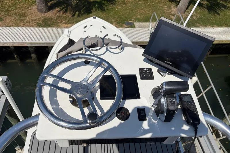 Slide: The Image of 2021 Pair Customs 24 Center Console MV helm with steering wheel and navigation equipment. - 9