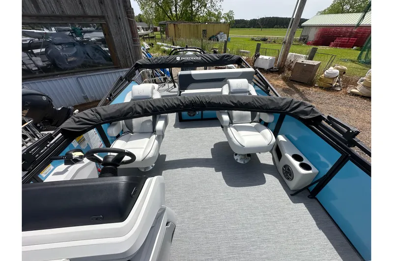 Slide: The Image of 2026 Godfrey Sweetwater 2286 SFLC pontoon boat interior with plush seating and modern design. - 10