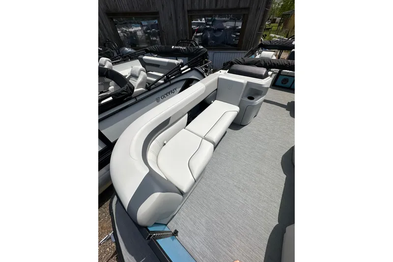 Slide: The Image of 2026 Godfrey Sweetwater 2286 SFLC boat interior with sleek seating and modern design. - 11