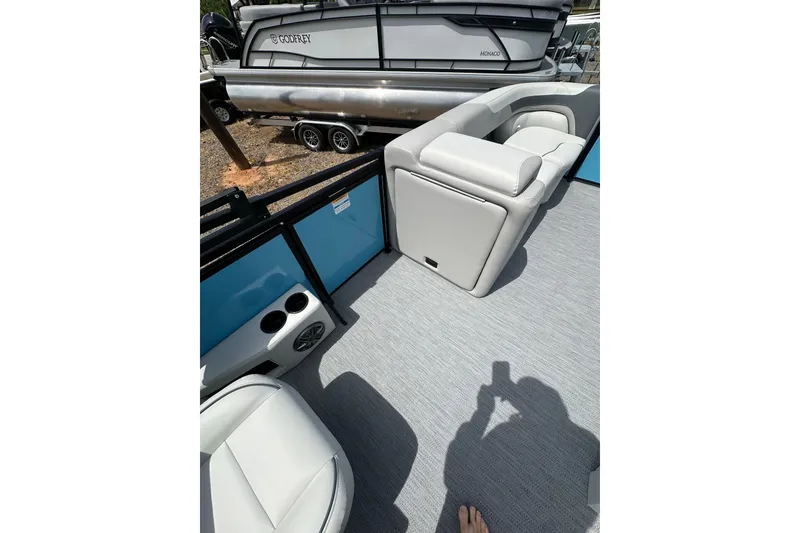 Slide: The Image of Interior view of 2026 Godfrey Sweetwater 2286 SFLC pontoon boat with seating and cup holders. - 12
