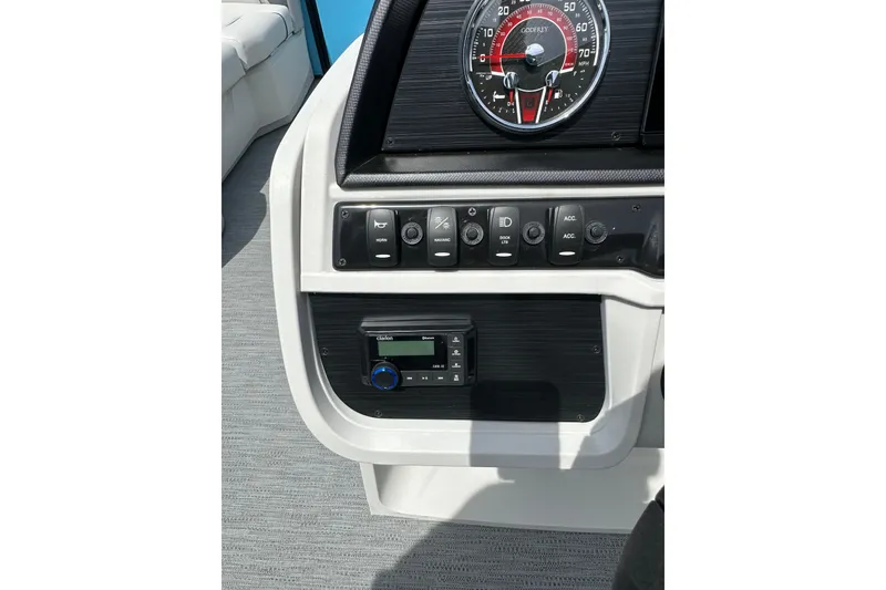 Slide: The Image of 2026 Godfrey Sweetwater 2286 SFLC dashboard with controls and speedometer. - 14