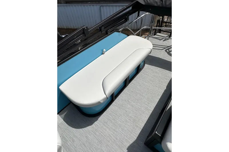 Slide: The Image of 2026 Godfrey Sweetwater 2286 SFLC boat seat with white upholstery and blue accents. - 16