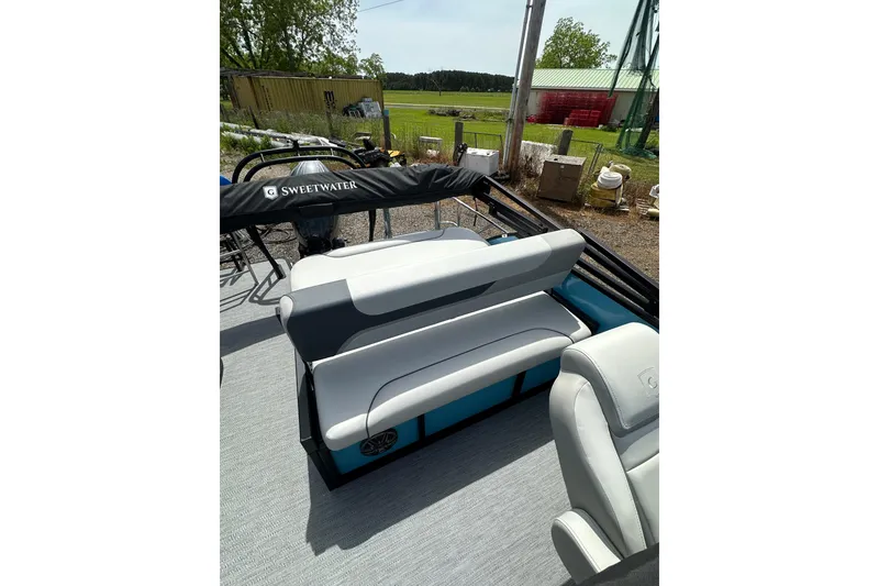 Slide: The Image of 2026 Godfrey Sweetwater 2286 SFLC pontoon boat interior with comfortable seating and sleek design. - 17