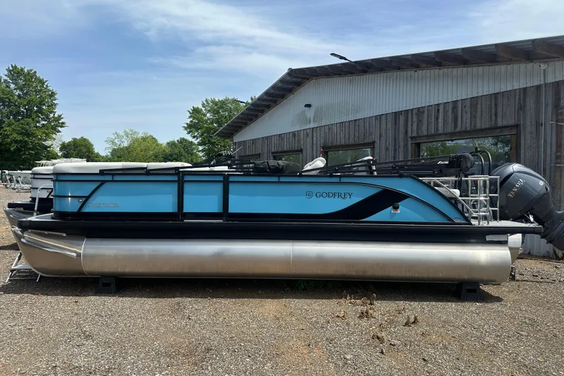 Slide: The Image of 2026 Godfrey Sweetwater 2286 SFLC pontoon boat parked outdoors. - 3