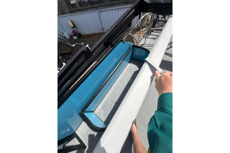 Slide: The Image of 2026 Godfrey Sweetwater 2286 SFLC boat interior with blue and white seating. - 31