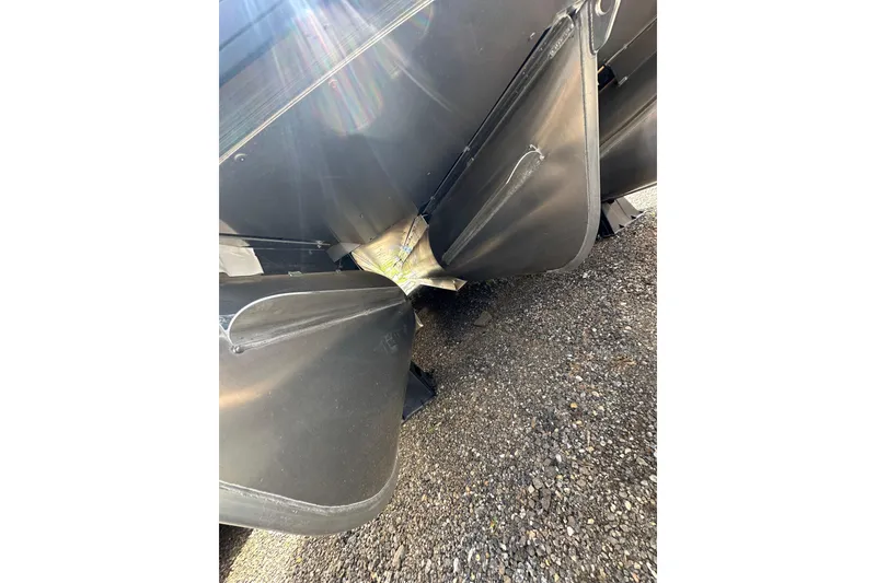 Slide: The Image of Close-up of 2026 Godfrey Sweetwater 2286 SFLC pontoon boat underside on gravel. - 33