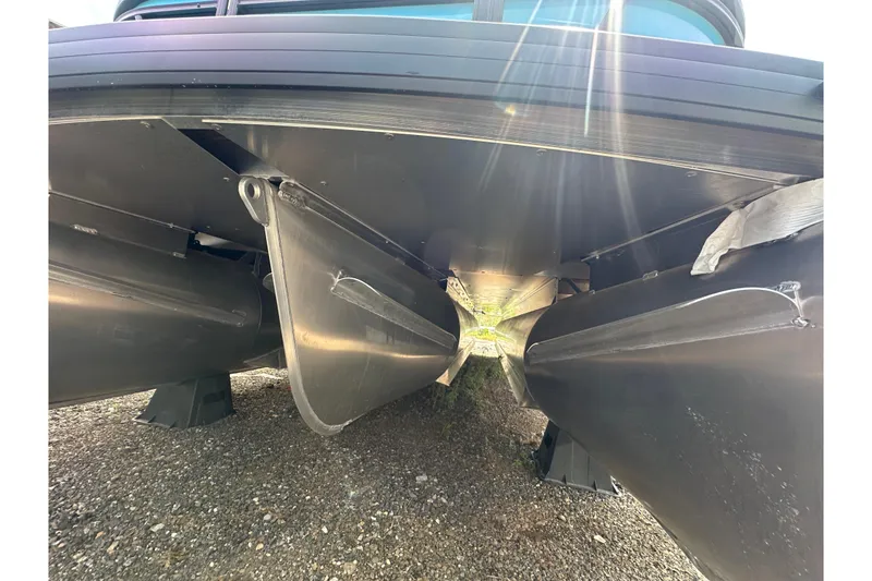 Slide: The Image of Underneath view of 2026 Godfrey Sweetwater 2286 SFLC pontoon boat with sunlight reflections. - 34