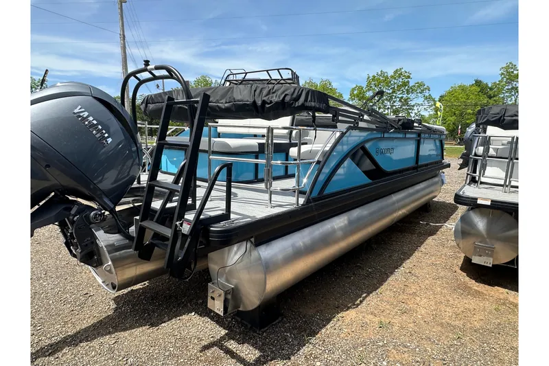 Slide: The Image of 2026 Godfrey Sweetwater 2286 SFLC pontoon boat with Yamaha engine, parked outdoors. - 6