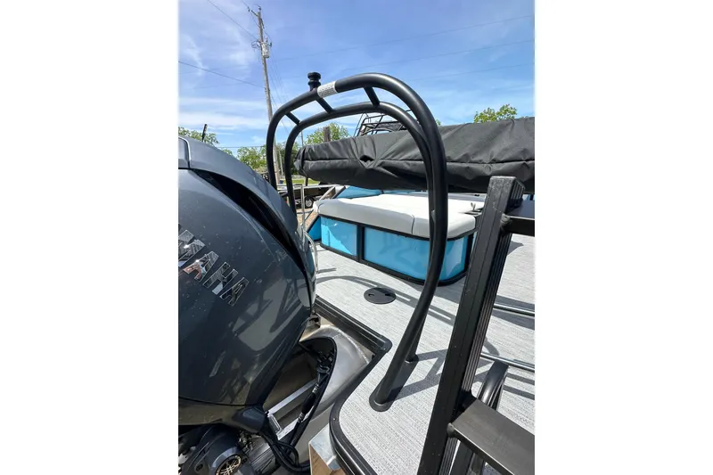 Slide: The Image of 2026 Godfrey Sweetwater 2286 SFLC boat with Yamaha engine, featuring sleek design and seating area. - 7