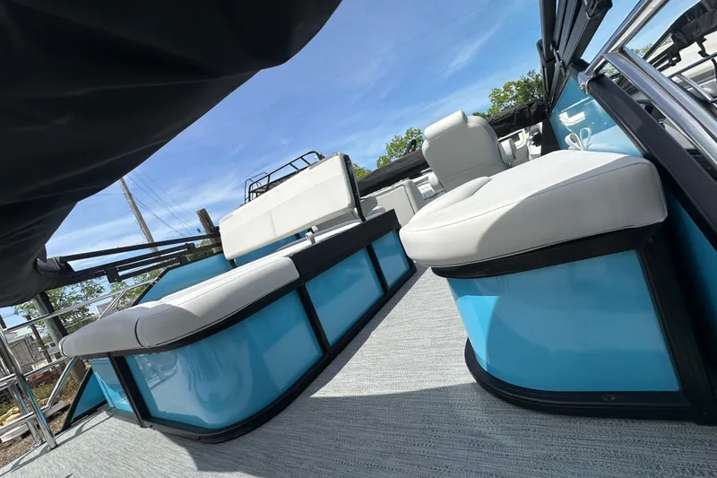 Slide: The Image of 2026 Godfrey Sweetwater 2286 SFLC pontoon boat interior with blue accents and white seating. - 8