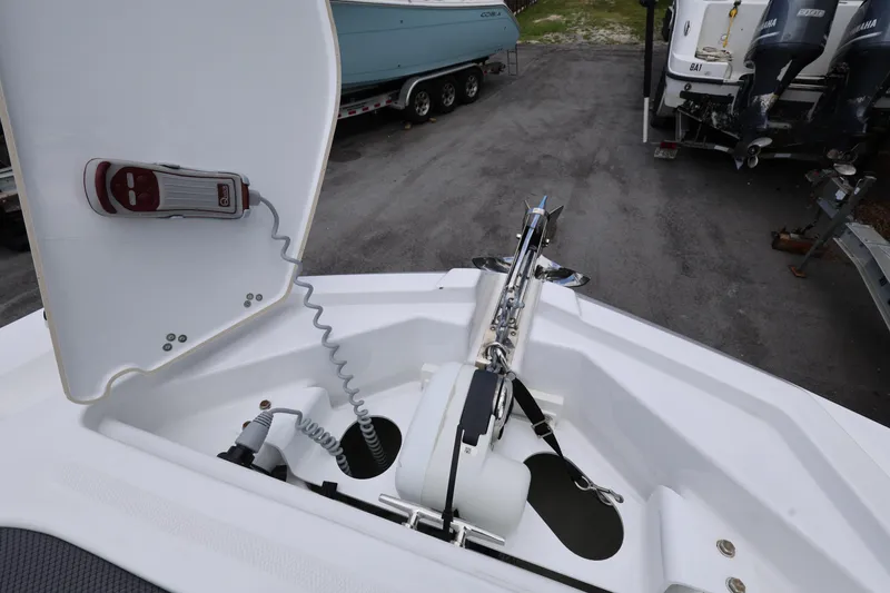 Slide: The Image of 2024 Scarab 285 ID boat anchor compartment with control panel. - 20