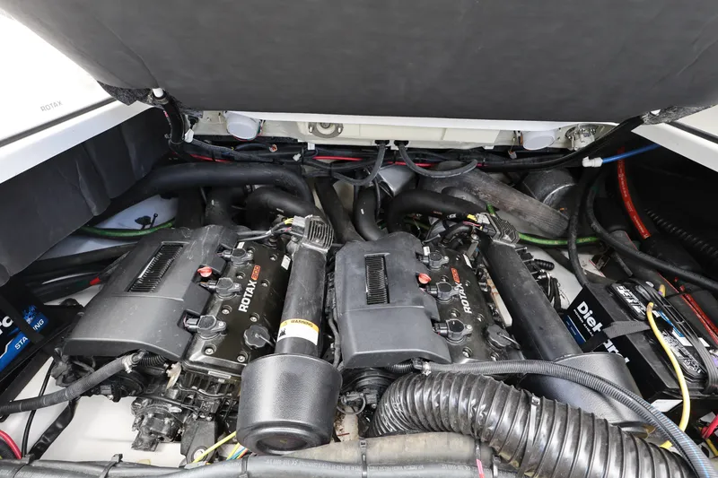 Slide: The Image of Engine compartment of 2024 Scarab 285 ID boat featuring Rotax engines. - 23