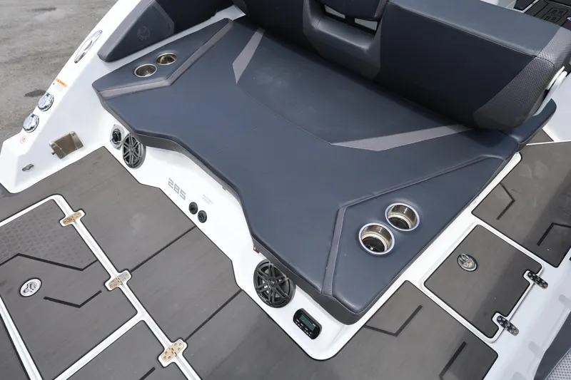 Slide: The Image of 2024 Scarab 285 ID boat interior with seating, cup holders, and speakers. - 24