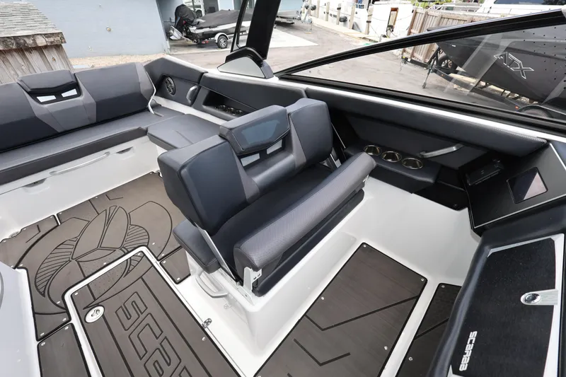 Slide: The Image of 2024 Scarab 285 ID boat interior with sleek seating and modern design elements. - 9