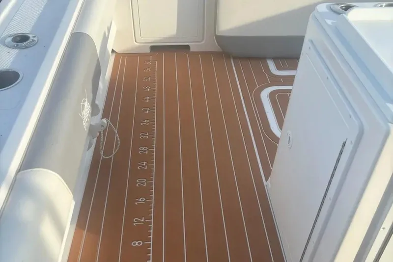 Slide: The Image of 2023 Steiger Craft 31 Fisherman boat deck with measuring ruler and storage compartments. - 7