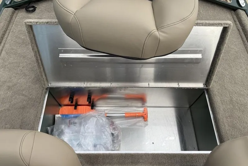 Slide: The Image of Storage compartment in 2026 Tracker Bass Tracker Classic Limited boat with seat and equipment. - 14