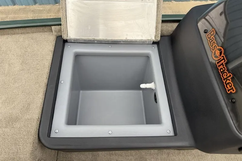 Slide: The Image of Open storage compartment in 2026 Tracker Bass Tracker Classic Limited boat. - 17