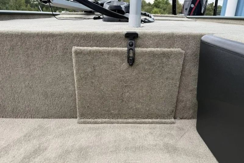 Slide: The Image of 2026 Tracker Bass Tracker Classic Limited boat interior with carpeted storage compartment. - 20