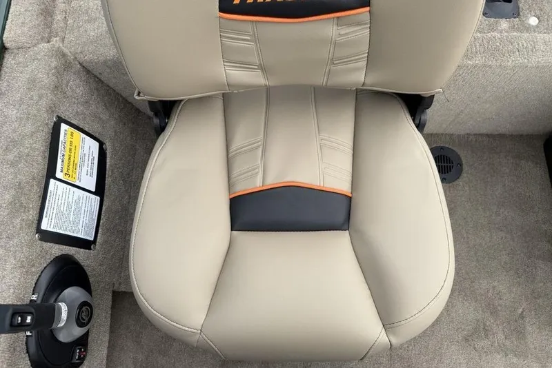 Slide: The Image of 2026 Tracker Bass Tracker Classic Limited boat seat, beige with black and orange accents. - 22