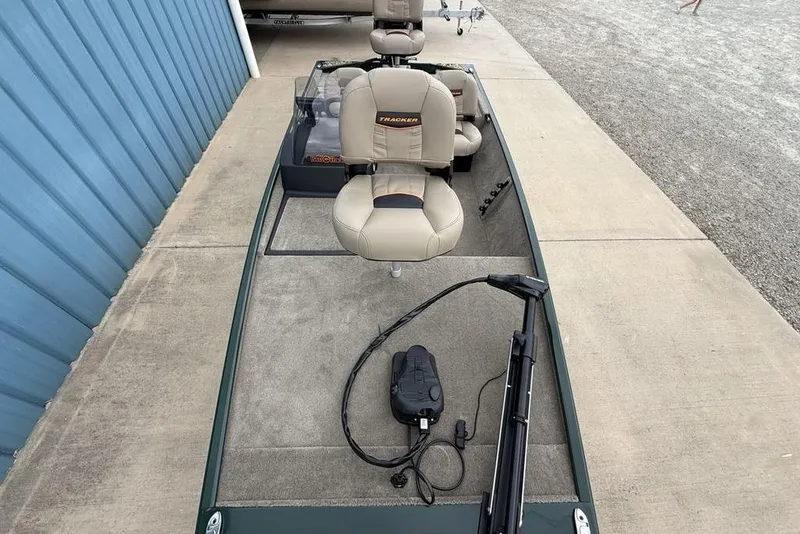 Slide: The Image of 2026 Tracker Bass Tracker Classic Limited boat with beige seats and fishing equipment. - 24