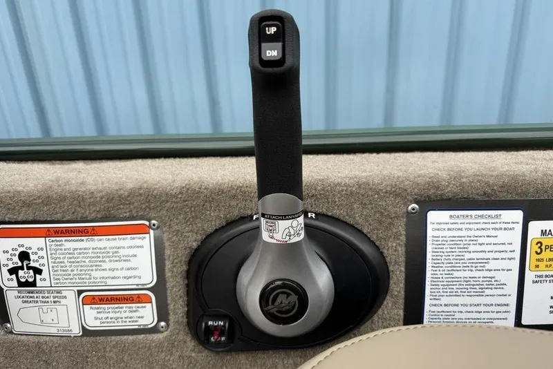 Slide: The Image of Throttle control lever on 2026 Tracker Bass Tracker Classic Limited boat dashboard. - 7