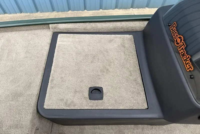 Slide: The Image of 2026 Tracker Bass Tracker Classic Limited boat deck with carpeted storage compartment. - 8