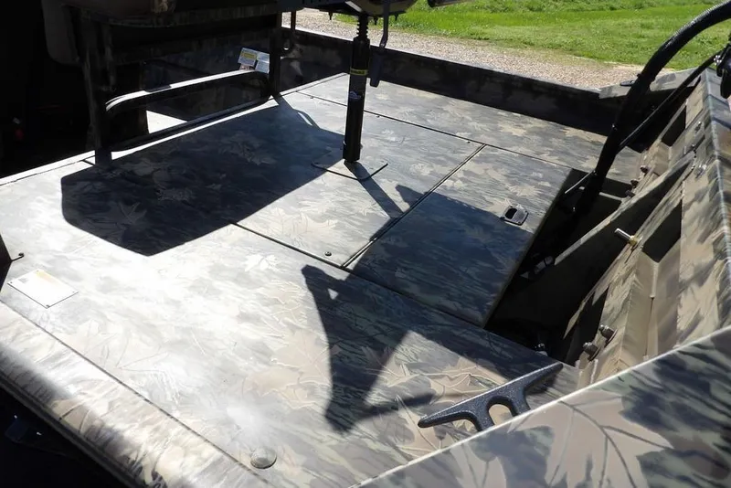 Slide: The Image of 2026 Crestliner 1860 Retriever CC Tunnel boat interior with camouflage design. - 12