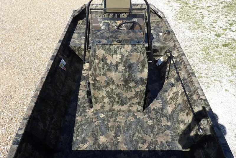Slide: The Image of 2026 Crestliner 1860 Retriever CC Tunnel boat with camouflage design, viewed from above. - 19