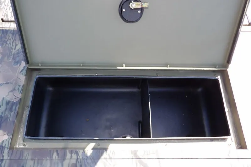 Slide: The Image of Open storage compartment in 2026 Crestliner 1860 Retriever CC Tunnel boat. - 20